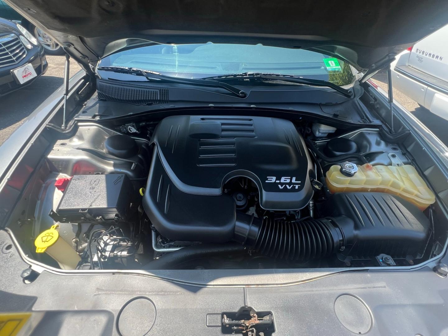 2012 GRAY /Black Leather Dodge Charger SXT (2C3CDXHG4CH) with an 3.6L V6 DOHC 24V engine, 5 Speed Automatic transmission, located at 1018 Brunswick Ave, Trenton, NJ, 08638, (609) 989-0900, 40.240086, -74.748085 - Photo#7