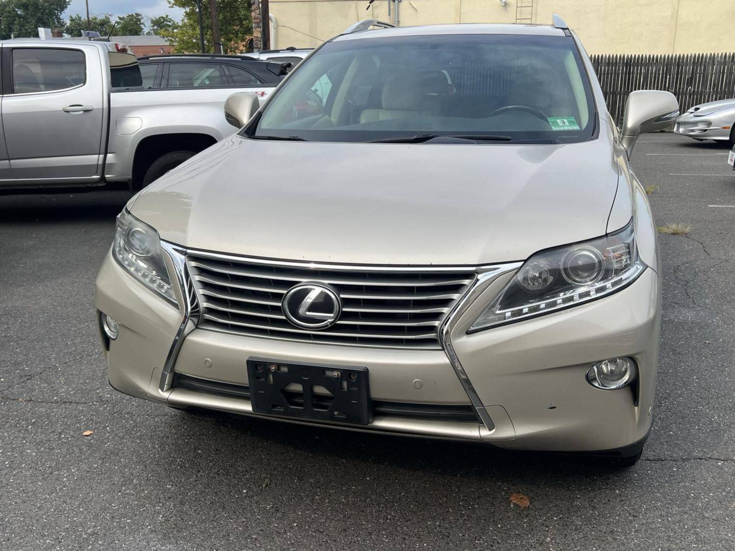 2014 Gold /Tan Leather Lexus RX 350 AWD (2T2BK1BA4EC) with an 3.5L V6 DOHC 24V engine, 5-Speed Automatic transmission, located at 1018 Brunswick Ave, Trenton, NJ, 08638, (609) 989-0900, 40.240086, -74.748085 - Photo#0