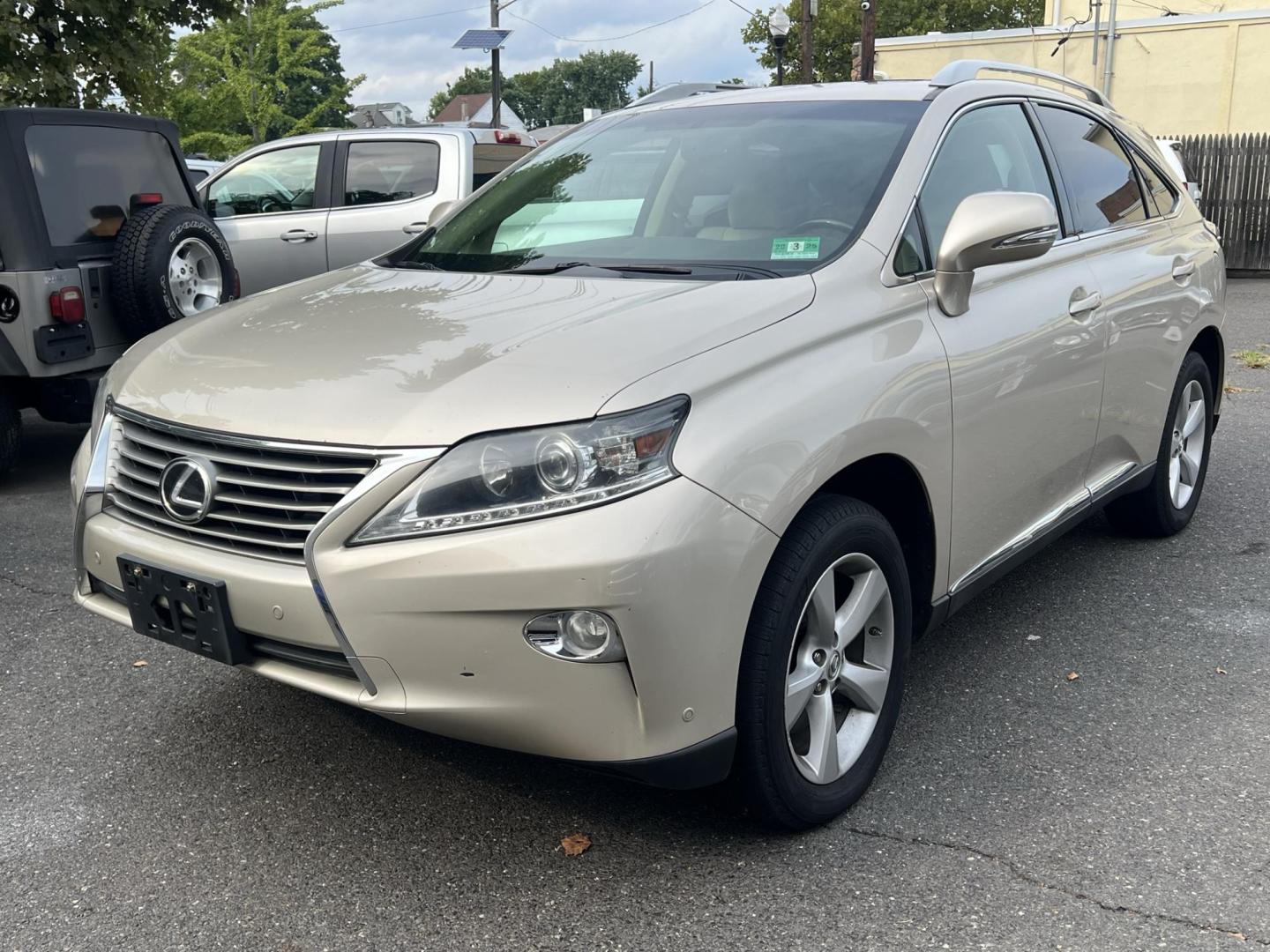 2014 Gold /Tan Leather Lexus RX 350 AWD (2T2BK1BA4EC) with an 3.5L V6 DOHC 24V engine, 5-Speed Automatic transmission, located at 1018 Brunswick Ave, Trenton, NJ, 08638, (609) 989-0900, 40.240086, -74.748085 - Photo#2