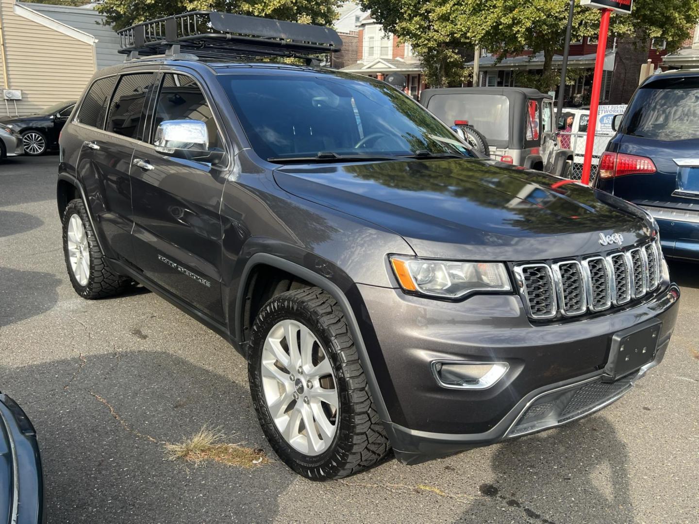 2017 BLACK /Black Leather Jeep Grand Cherokee Limited 4WD (1C4RJFBG0HC) with an 3.6L V6 DOHC 24V engine, 8A transmission, located at 1018 Brunswick Ave, Trenton, NJ, 08638, (609) 989-0900, 40.240086, -74.748085 - Photo#0