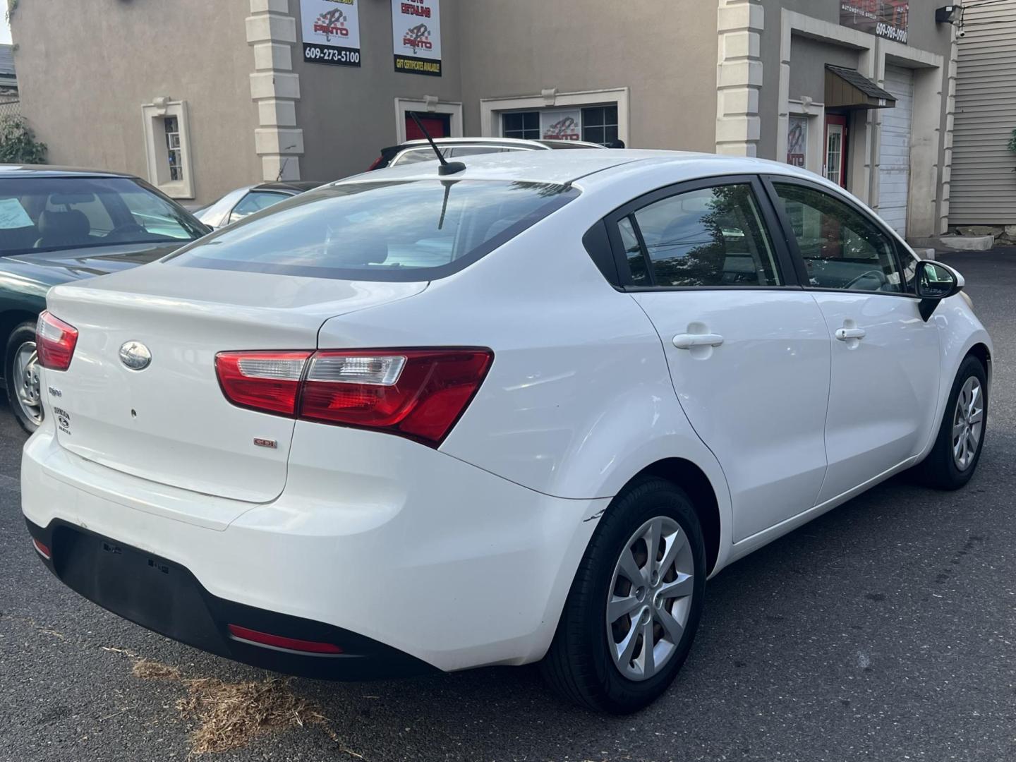 2013 White /Gray Kia Rio LX (KNADM4A35D6) with an 1.6L L4 DOHC 16V engine, located at 1018 Brunswick Ave, Trenton, NJ, 08638, (609) 989-0900, 40.240086, -74.748085 - Photo#4