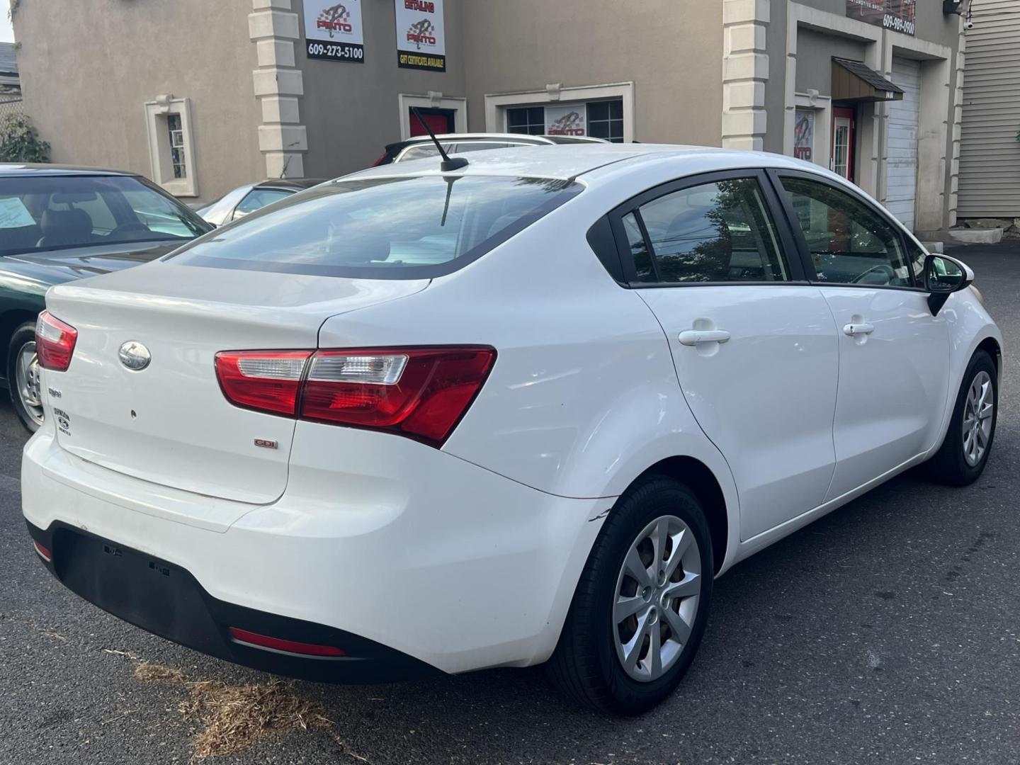 2013 White /Gray Kia Rio LX (KNADM4A35D6) with an 1.6L L4 DOHC 16V engine, located at 1018 Brunswick Ave, Trenton, NJ, 08638, (609) 989-0900, 40.240086, -74.748085 - Photo#1