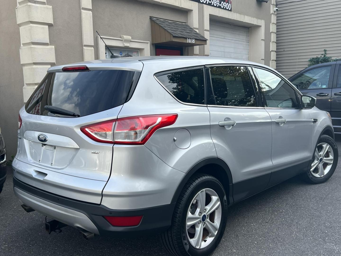 2016 SILVER /Gray Ford Escape SE FWD (1FMCU0G70GU) with an 2.5L L4 DOHC 16V engine, 6-Speed Automatic transmission, located at 1018 Brunswick Ave, Trenton, NJ, 08638, (609) 989-0900, 40.240086, -74.748085 - Photo#2