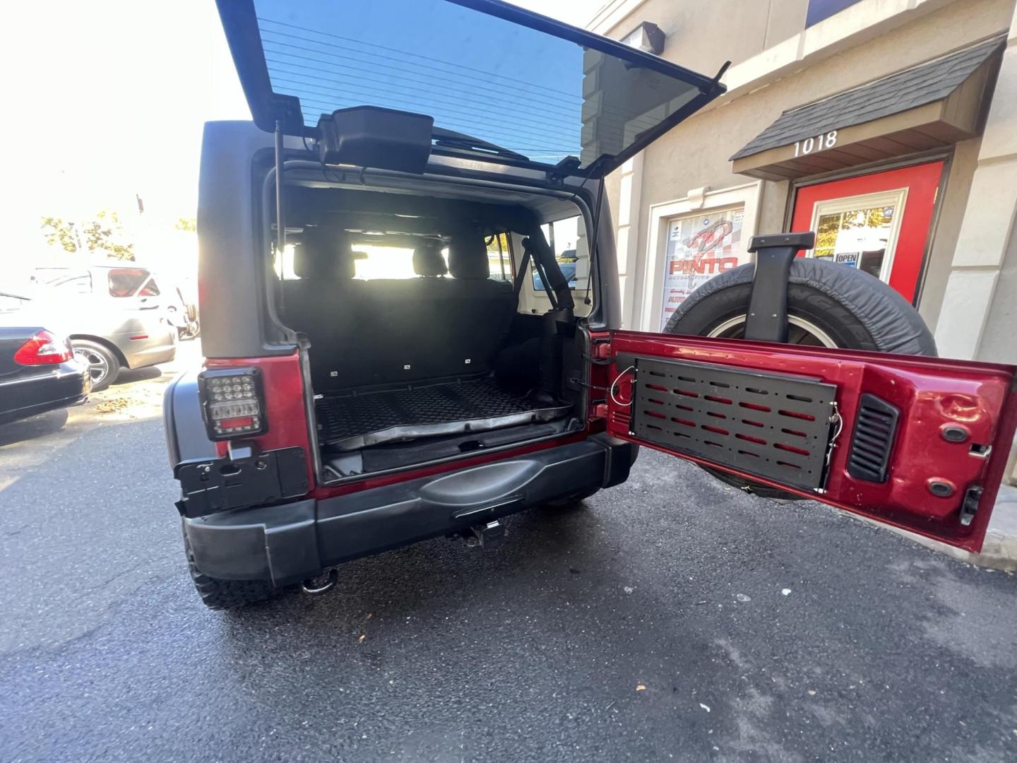 2013 Jeep Wrangler Unlimited Sport 4WD (1C4HJWDG2DL) with an 3.6L V6 DOHC 24V FFV engine, located at 1018 Brunswick Ave, Trenton, NJ, 08638, (609) 989-0900, 40.240086, -74.748085 - Photo#20