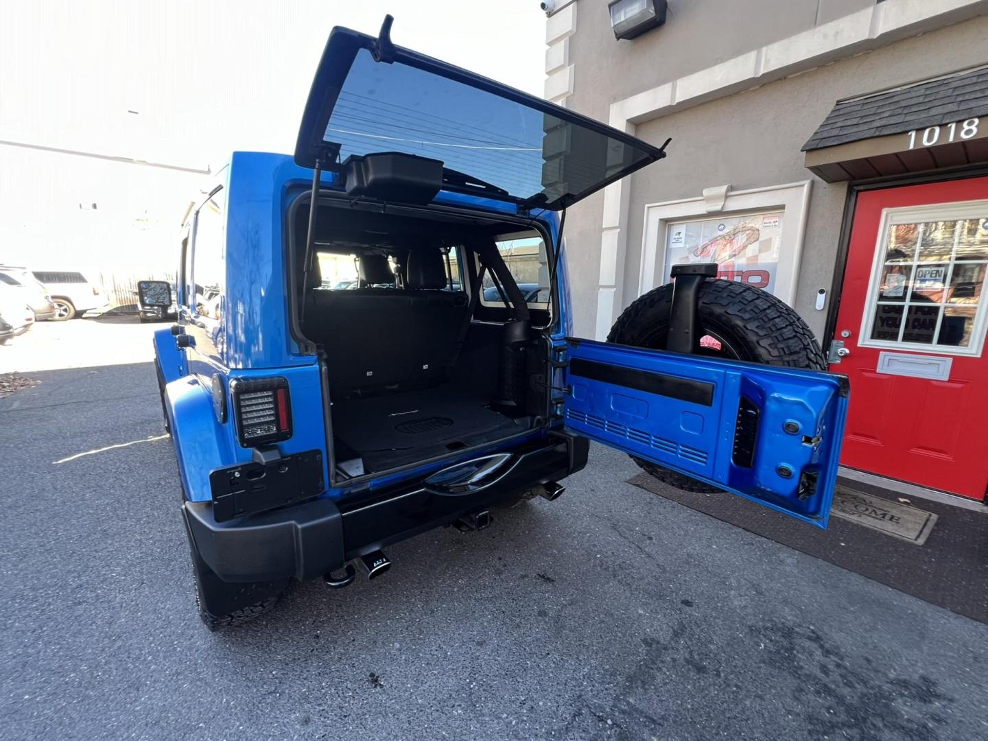 2015 Blue /Black Leather Jeep Wrangler Unlimited Sahara 4WD (1C4BJWEG7FL) with an 3.6L V6 DOHC 24V FFV engine, located at 1018 Brunswick Ave, Trenton, NJ, 08638, (609) 989-0900, 40.240086, -74.748085 - Photo#11