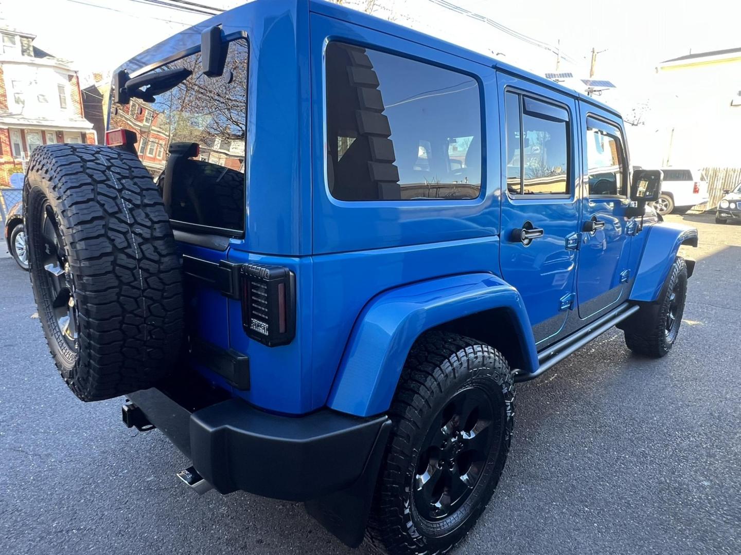 2015 Blue /Black Leather Jeep Wrangler Unlimited Sahara 4WD (1C4BJWEG7FL) with an 3.6L V6 DOHC 24V FFV engine, located at 1018 Brunswick Ave, Trenton, NJ, 08638, (609) 989-0900, 40.240086, -74.748085 - Photo#14