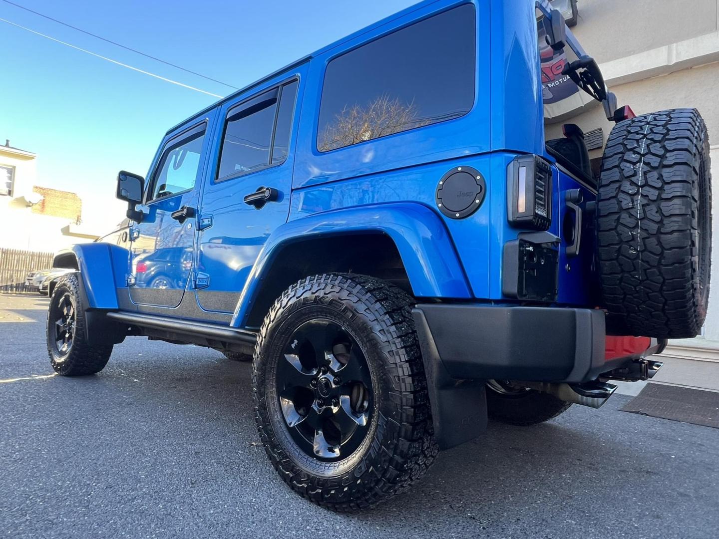 2015 Blue /Black Leather Jeep Wrangler Unlimited Sahara 4WD (1C4BJWEG7FL) with an 3.6L V6 DOHC 24V FFV engine, located at 1018 Brunswick Ave, Trenton, NJ, 08638, (609) 989-0900, 40.240086, -74.748085 - Photo#19