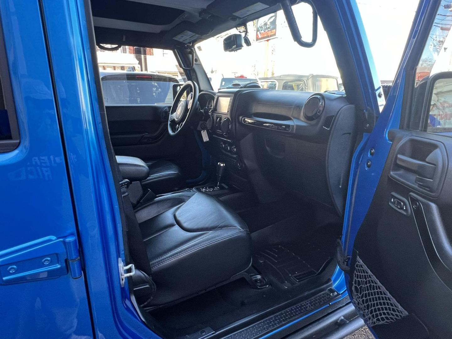 2015 Blue /Black Leather Jeep Wrangler Unlimited Sahara 4WD (1C4BJWEG7FL) with an 3.6L V6 DOHC 24V FFV engine, located at 1018 Brunswick Ave, Trenton, NJ, 08638, (609) 989-0900, 40.240086, -74.748085 - Photo#24