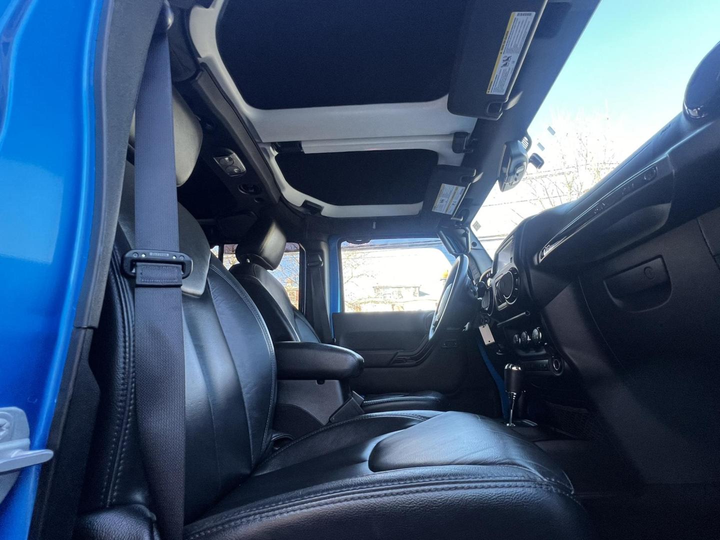 2015 Blue /Black Leather Jeep Wrangler Unlimited Sahara 4WD (1C4BJWEG7FL) with an 3.6L V6 DOHC 24V FFV engine, located at 1018 Brunswick Ave, Trenton, NJ, 08638, (609) 989-0900, 40.240086, -74.748085 - Photo#27