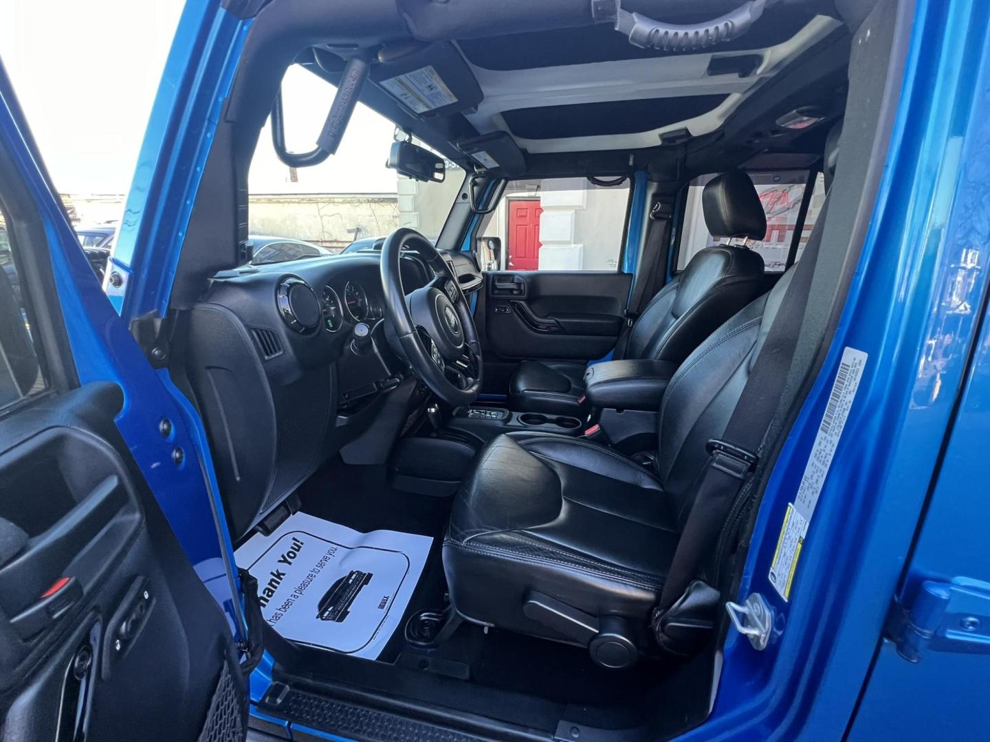 2015 Blue /Black Leather Jeep Wrangler Unlimited Sahara 4WD (1C4BJWEG7FL) with an 3.6L V6 DOHC 24V FFV engine, located at 1018 Brunswick Ave, Trenton, NJ, 08638, (609) 989-0900, 40.240086, -74.748085 - Photo#37