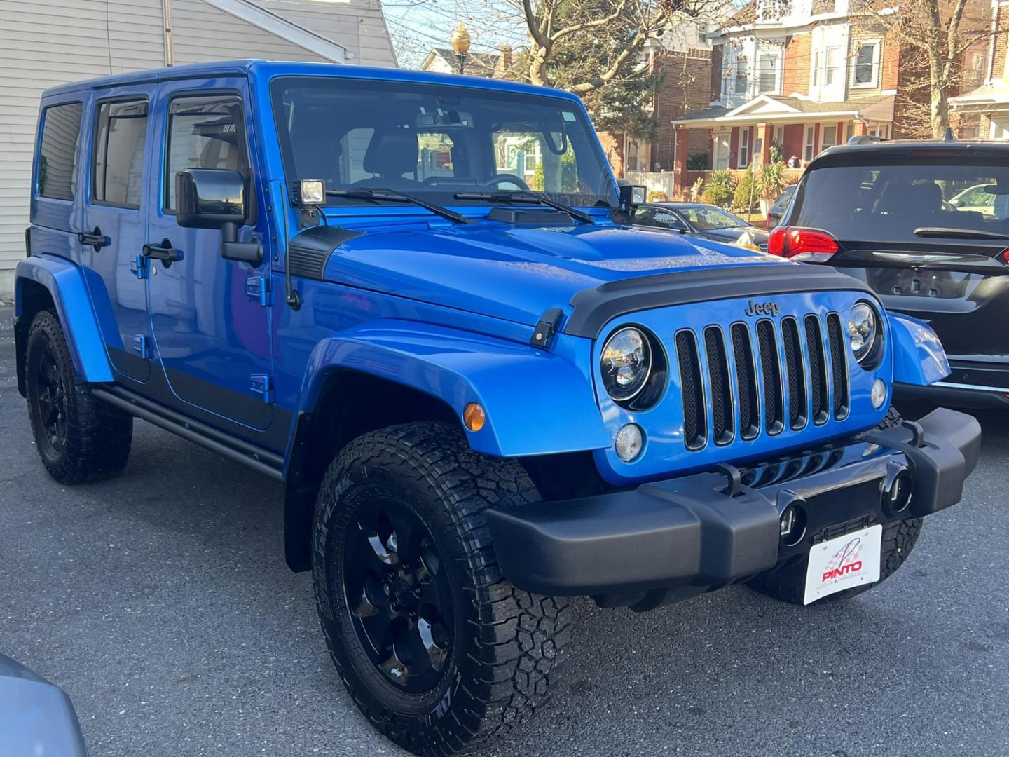 2015 Blue /Black Leather Jeep Wrangler Unlimited Sahara 4WD (1C4BJWEG7FL) with an 3.6L V6 DOHC 24V FFV engine, located at 1018 Brunswick Ave, Trenton, NJ, 08638, (609) 989-0900, 40.240086, -74.748085 - Photo#4