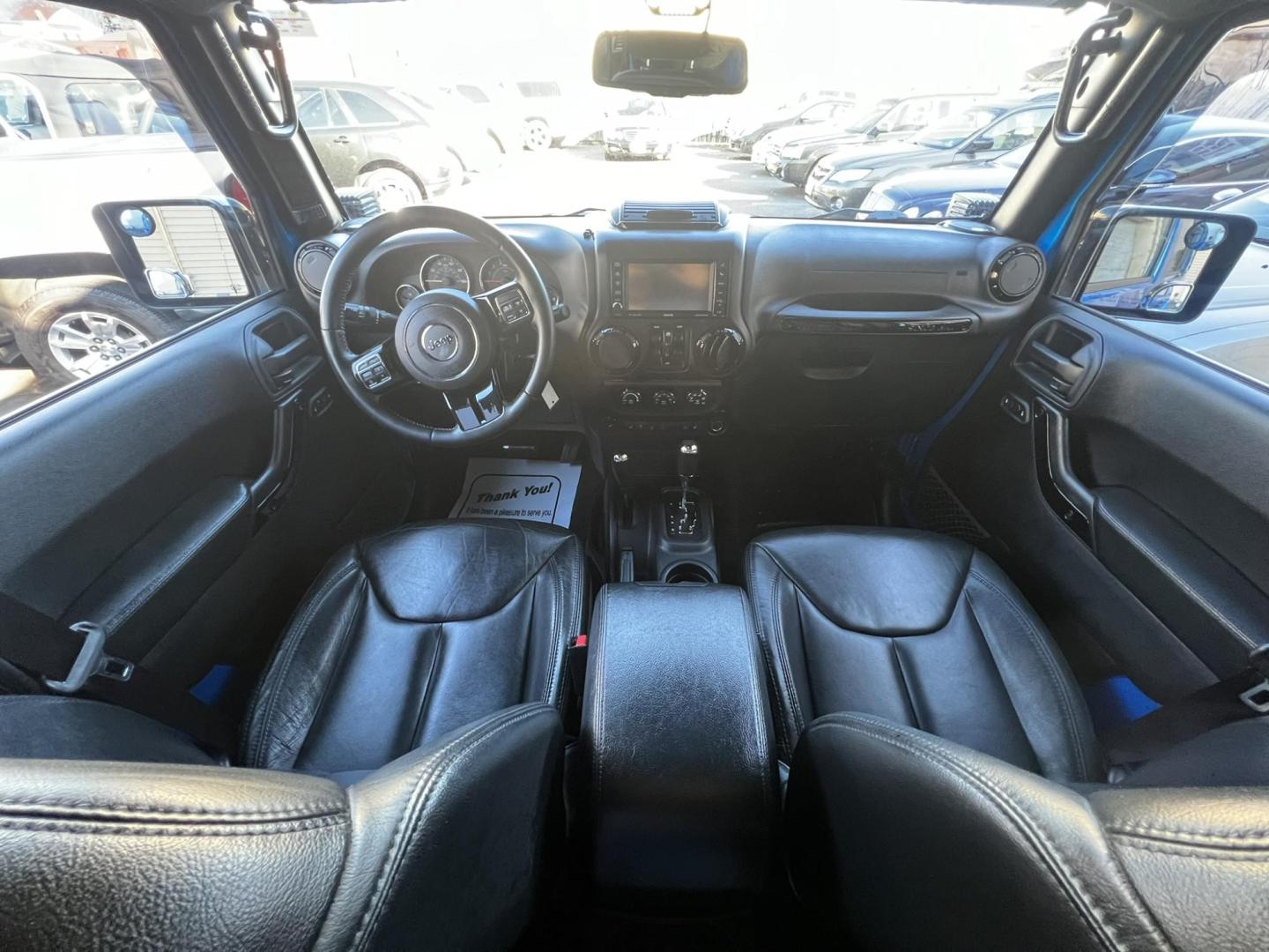 2015 Blue /Black Leather Jeep Wrangler Unlimited Sahara 4WD (1C4BJWEG7FL) with an 3.6L V6 DOHC 24V FFV engine, located at 1018 Brunswick Ave, Trenton, NJ, 08638, (609) 989-0900, 40.240086, -74.748085 - Photo#40