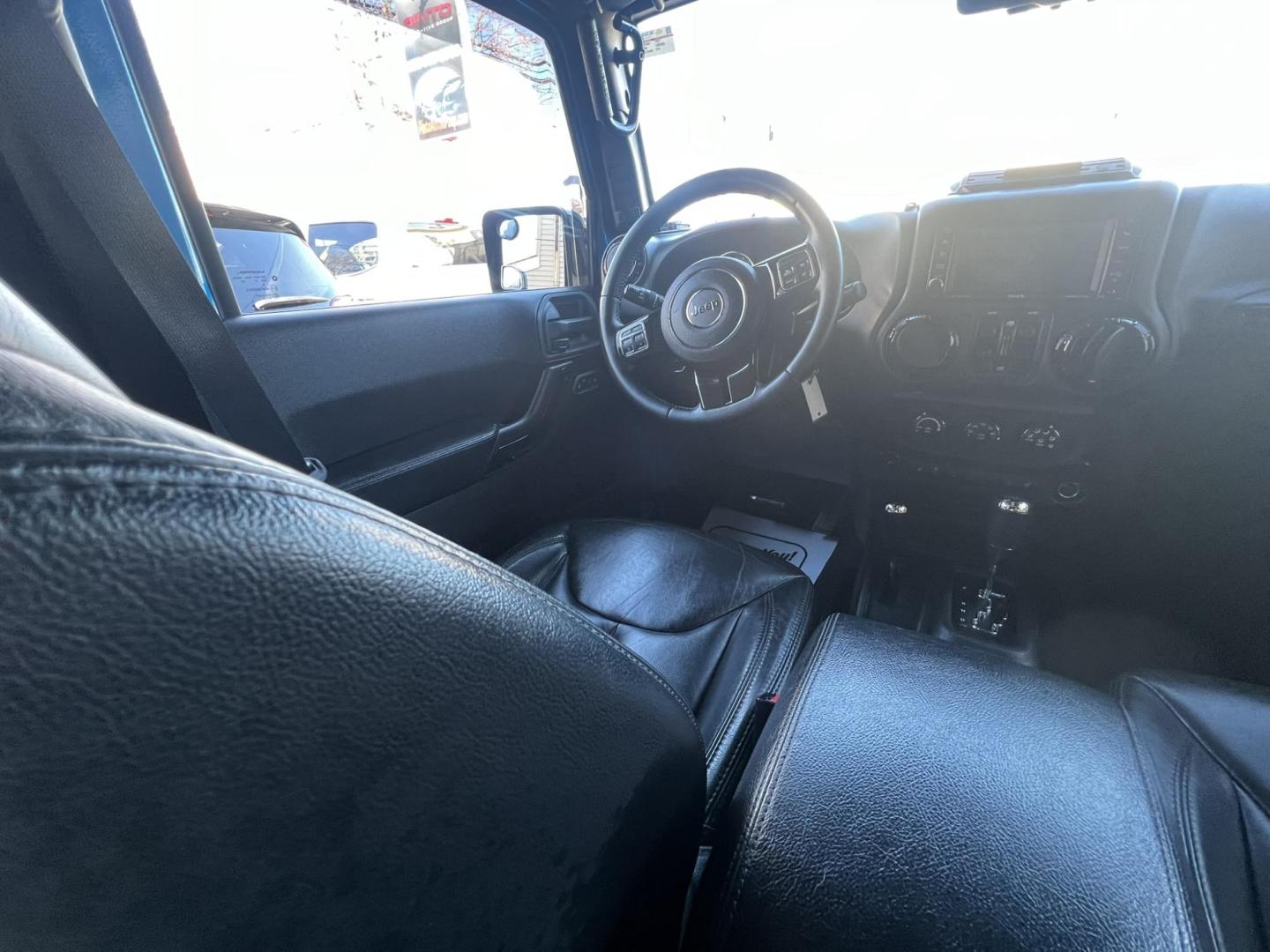 2015 Blue /Black Leather Jeep Wrangler Unlimited Sahara 4WD (1C4BJWEG7FL) with an 3.6L V6 DOHC 24V FFV engine, located at 1018 Brunswick Ave, Trenton, NJ, 08638, (609) 989-0900, 40.240086, -74.748085 - Photo#45