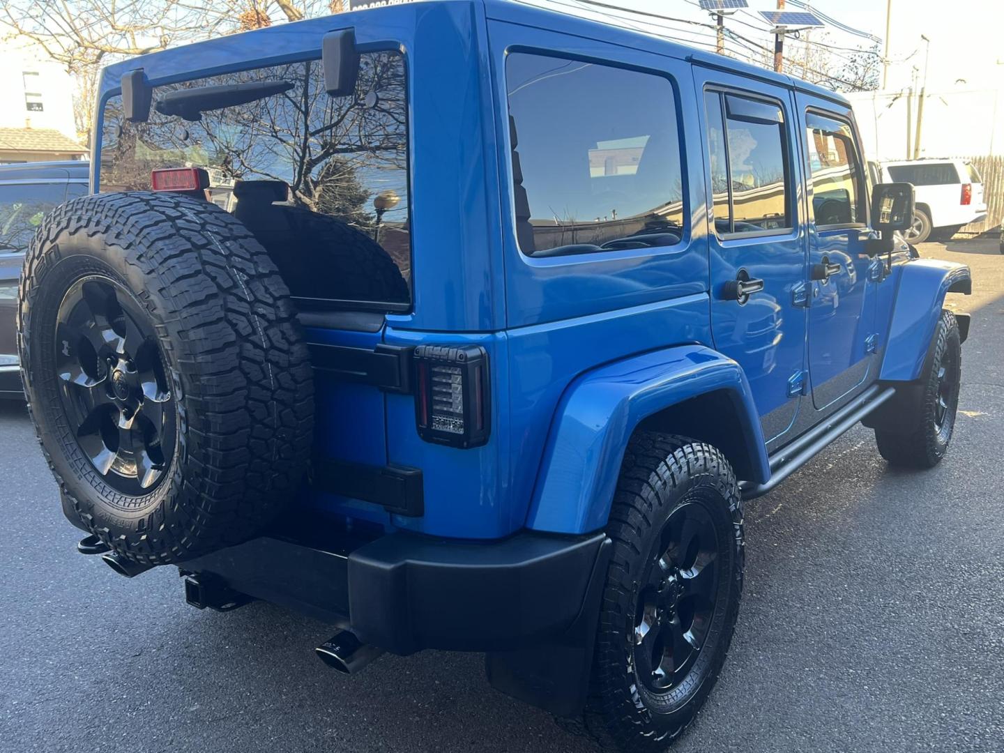 2015 Blue /Black Leather Jeep Wrangler Unlimited Sahara 4WD (1C4BJWEG7FL) with an 3.6L V6 DOHC 24V FFV engine, located at 1018 Brunswick Ave, Trenton, NJ, 08638, (609) 989-0900, 40.240086, -74.748085 - Photo#5