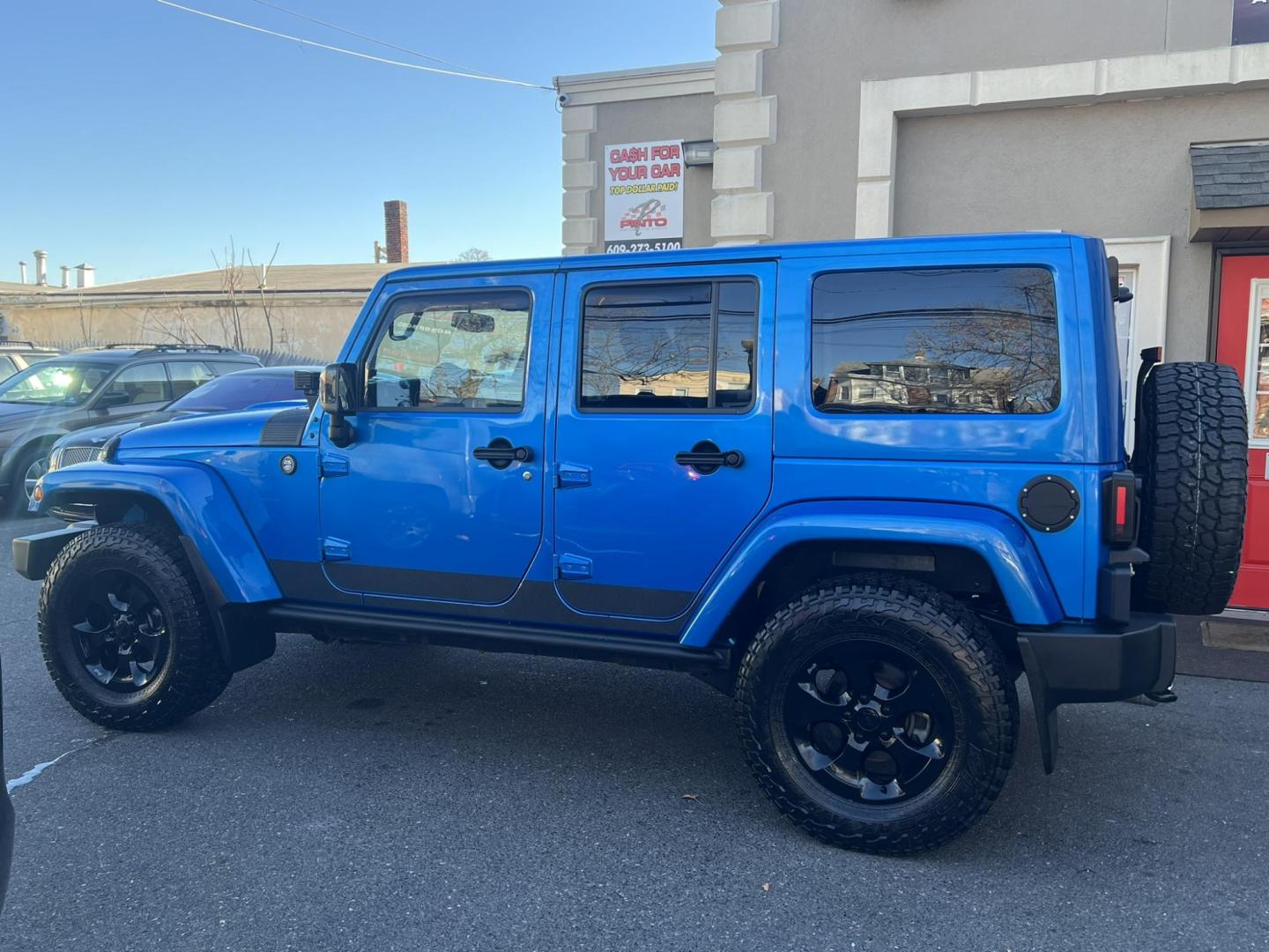 2015 Blue /Black Leather Jeep Wrangler Unlimited Sahara 4WD (1C4BJWEG7FL) with an 3.6L V6 DOHC 24V FFV engine, located at 1018 Brunswick Ave, Trenton, NJ, 08638, (609) 989-0900, 40.240086, -74.748085 - Photo#8