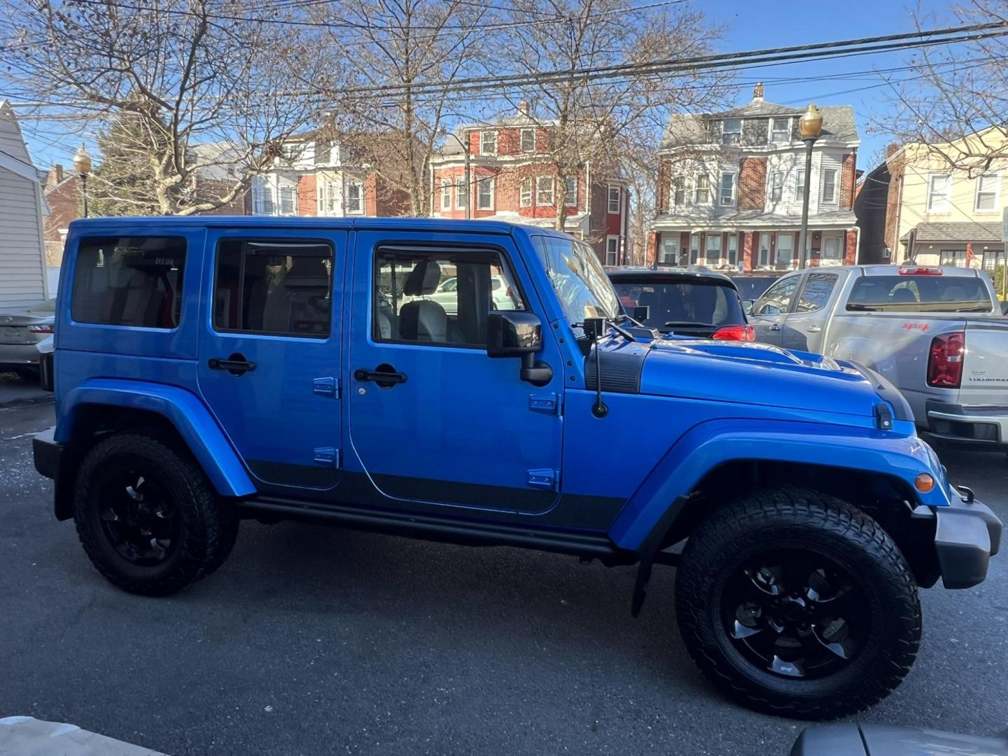 2015 Blue /Black Leather Jeep Wrangler Unlimited Sahara 4WD (1C4BJWEG7FL) with an 3.6L V6 DOHC 24V FFV engine, located at 1018 Brunswick Ave, Trenton, NJ, 08638, (609) 989-0900, 40.240086, -74.748085 - Photo#9