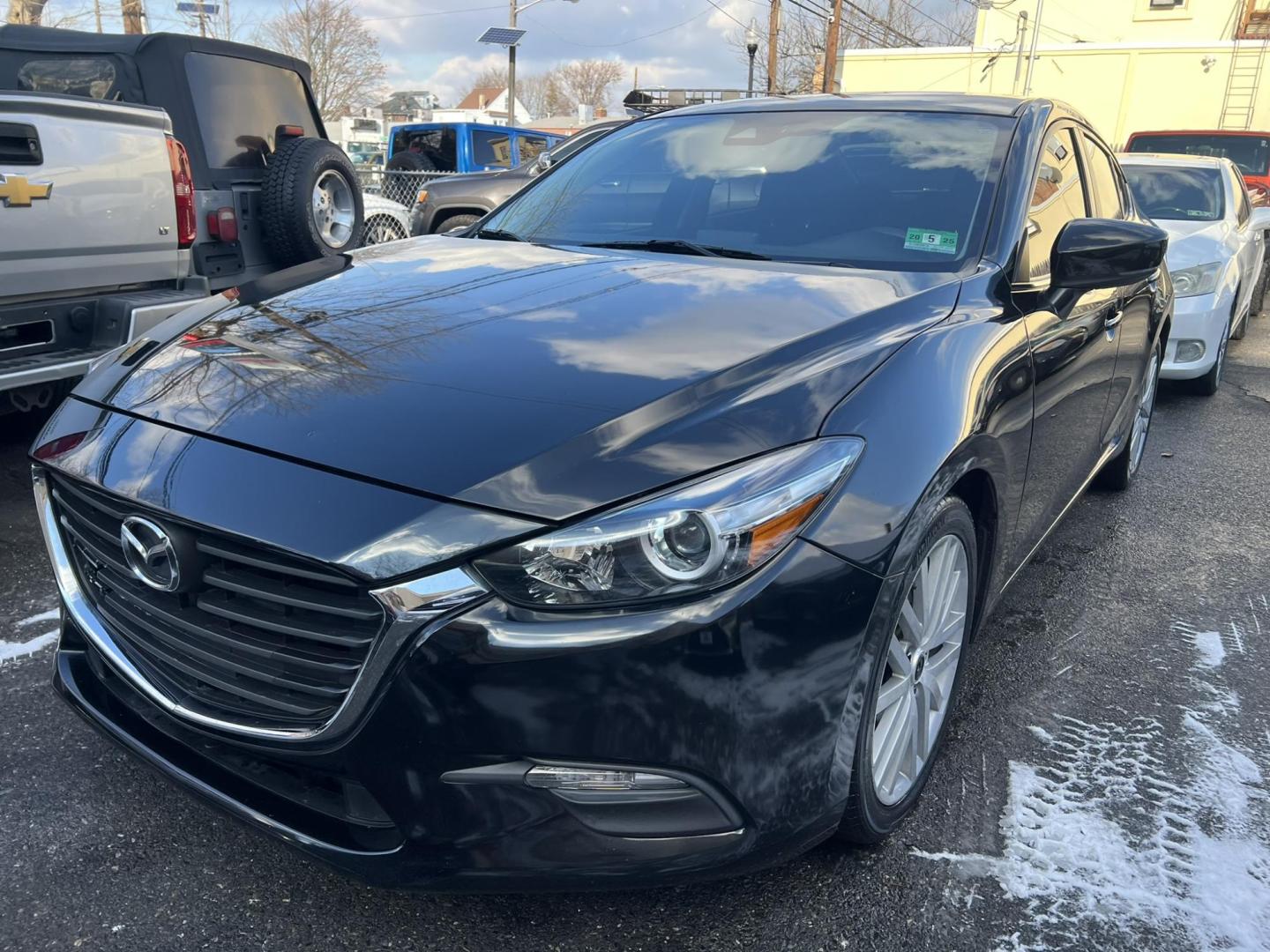 2018 BLACK /Black Mazda MAZDA3 i Sport MT 4-Door (3MZBN1U75JM) with an 2.0L L4 DOHC 16V engine, 6M transmission, located at 1018 Brunswick Ave, Trenton, NJ, 08638, (609) 989-0900, 40.240086, -74.748085 - Well here is a Black Beauty and is ready to go! Super clean and sporty being ready to go with financing available! This Mazda 3 Sport has been serviced up and detailed to look and drive like it belongs in a bubble or a car show!! - Photo#0