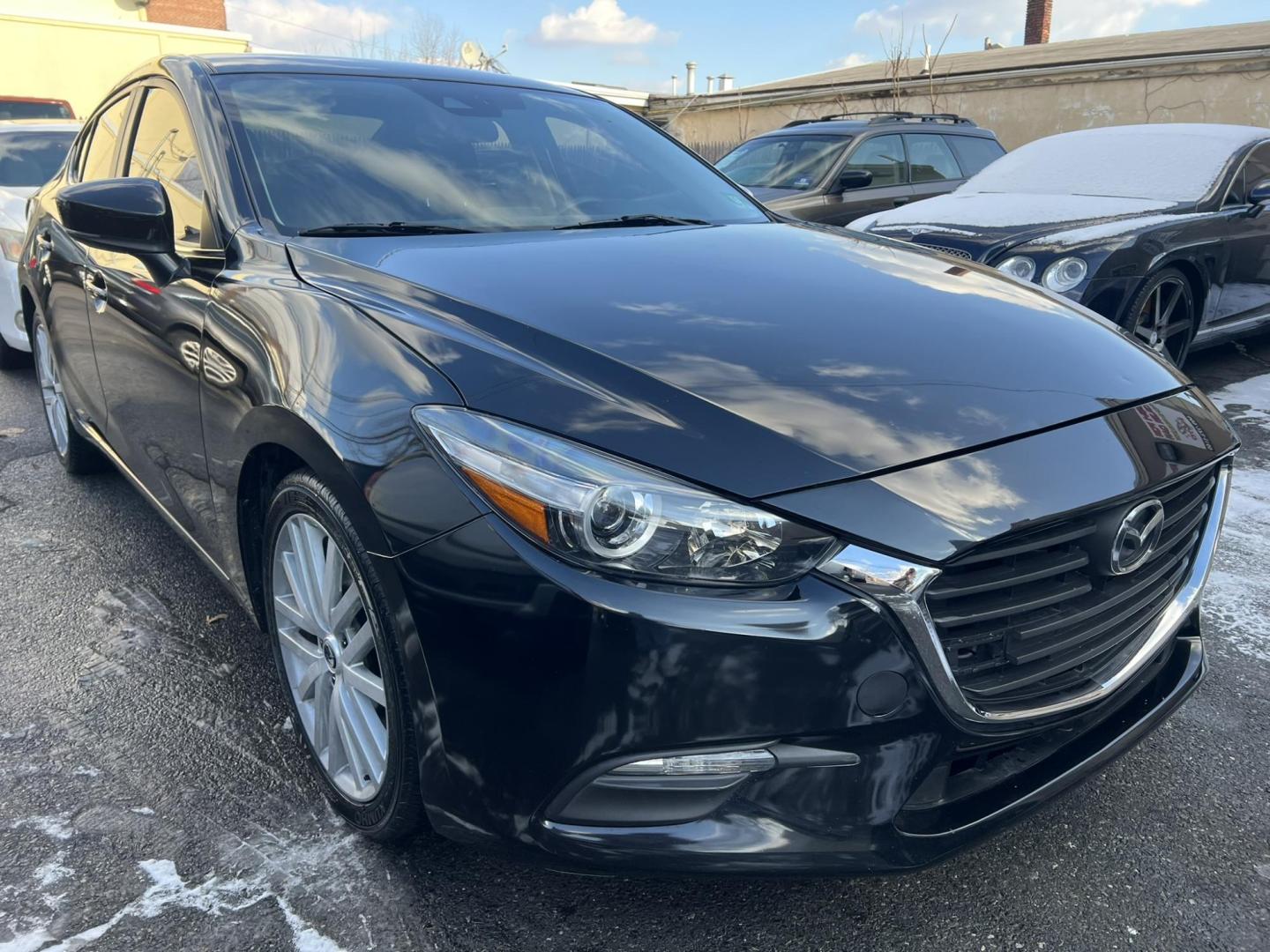 2018 BLACK /Black Mazda MAZDA3 i Sport MT 4-Door (3MZBN1U75JM) with an 2.0L L4 DOHC 16V engine, 6M transmission, located at 1018 Brunswick Ave, Trenton, NJ, 08638, (609) 989-0900, 40.240086, -74.748085 - Well here is a Black Beauty and is ready to go! Super clean and sporty being ready to go with financing available! This Mazda 3 Sport has been serviced up and detailed to look and drive like it belongs in a bubble or a car show!! - Photo#1