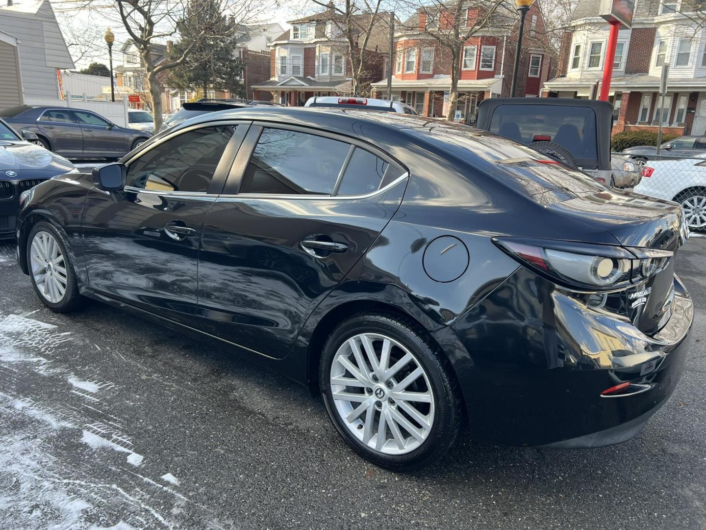 2018 BLACK /Black Mazda MAZDA3 i Sport MT 4-Door (3MZBN1U75JM) with an 2.0L L4 DOHC 16V engine, 6M transmission, located at 1018 Brunswick Ave, Trenton, NJ, 08638, (609) 989-0900, 40.240086, -74.748085 - Well here is a Black Beauty and is ready to go! Super clean and sporty being ready to go with financing available! This Mazda 3 Sport has been serviced up and detailed to look and drive like it belongs in a bubble or a car show!! - Photo#2