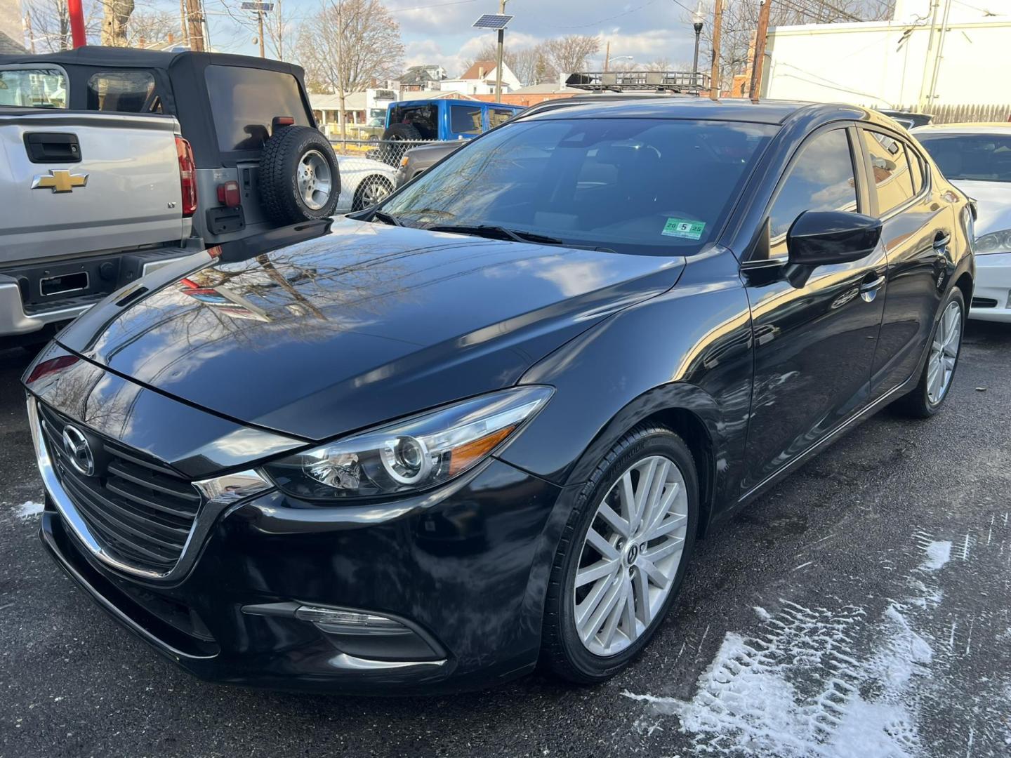 2018 BLACK /Black Mazda MAZDA3 i Sport MT 4-Door (3MZBN1U75JM) with an 2.0L L4 DOHC 16V engine, 6M transmission, located at 1018 Brunswick Ave, Trenton, NJ, 08638, (609) 989-0900, 40.240086, -74.748085 - Well here is a Black Beauty and is ready to go! Super clean and sporty being ready to go with financing available! This Mazda 3 Sport has been serviced up and detailed to look and drive like it belongs in a bubble or a car show!! - Photo#3